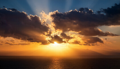 Fototapeta premium Cloudy Sunset With Sun Peeking Through