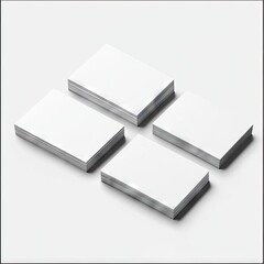 Four stacks of blank white cards on a light surface
