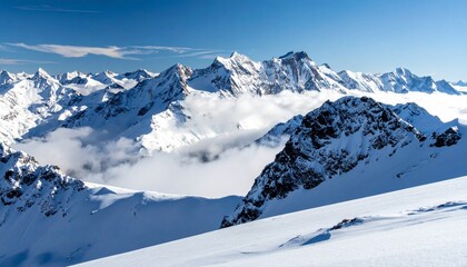 Fototapeta premium Majestic Snow-Capped Mountain Range Under a Clear Blue Sky with Wispy Clouds