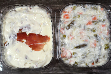 Background of The simple Russian salad, Olivier salad, features potatoes, carrots and peas coated in a creamy mayonnaise and Creamy Cheese Spread with Thin slices of pastrami, made from beef brisket