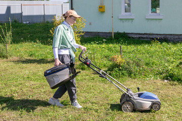 woman mowing grass
