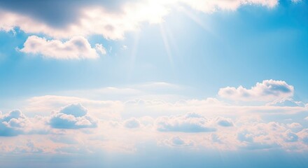 A serene blue sky with fluffy white clouds and a bright sun shining through.
