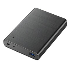 Fototapeta premium Closed black leather notebook and hard cover box near an isolated laptop on an office paper background for business data storage