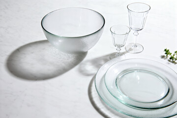 Textured Glass Servingware on White Marble with Dramatic Shadows