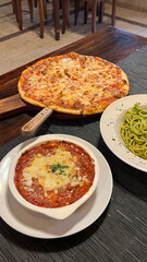 Traditional italian food pizza lasagna ravioli and spaghetti