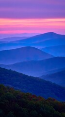 Fototapeta premium Misty mountain ranges at dawn