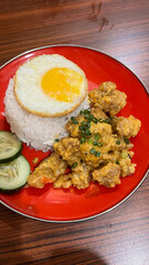 Butter rice with salted egg chicken crisp and fried egg