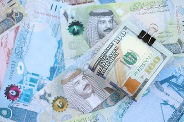 Bahraini dinar currency money bills and bunch of us dollars. The concept of currency exchange
