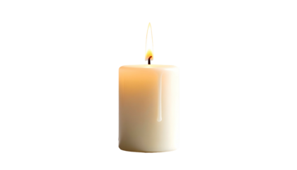 Lit white candle isolated on black background, glowing flame