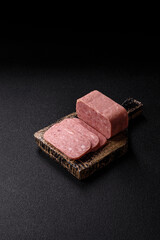 Spiced ham slices, canned meat for lunch sandwiches. Spiced ham as a food background
