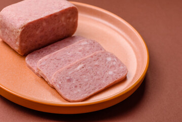 Spiced ham slices, canned meat for lunch sandwiches. Spiced ham as a food background