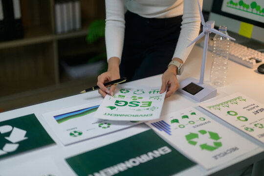 Businesswoman examining environmental social governance ESG documents