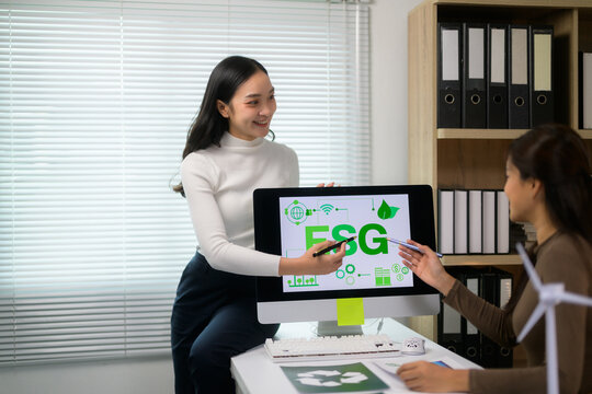 Businesswomen discussing ESG strategy planning for sustainability goals