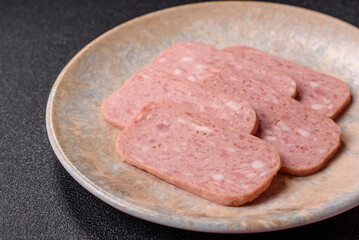 Spiced ham slices, canned meat for lunch sandwiches. Spiced ham as a food background