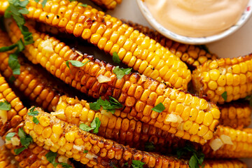 Homemade Spicy Corn Ribs with Mayo on a Plate, top view. Close-up.