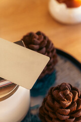 Blank Metallic Business Card Mockup Resting on Table with Gourmet Chocolate Treats