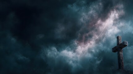 A solitary stone cross stands defiantly against a turbulent lightning streaked stormy night sky symbolizing hope amidst chaos