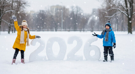 Joyful children play in a snowy park next to large snow numbers forming 2026, celebrating the upcoming new year with winter fun.