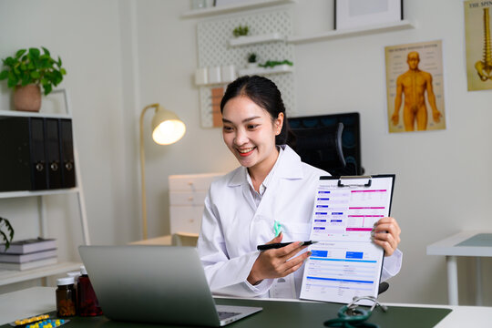 Asian doctor consulting patient online showing health chart