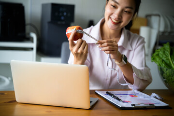 Woman nutritionist online consulting, explaining healthy diet concept