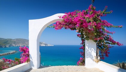 white archway with bougainvillea overlooking the blue sea