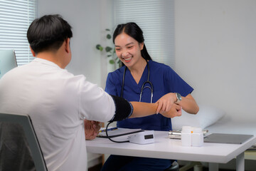 Nurse measuring patient blood pressure during health check