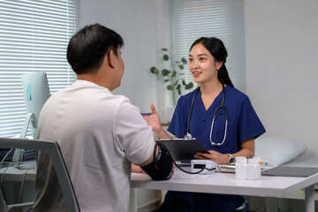 Female doctor explaining medical examination to male patient