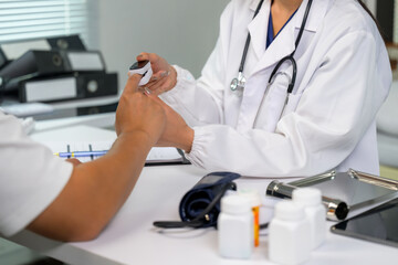 Doctor checking patient oxygen saturation with pulse oximeter