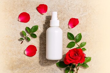 White Cosmetic Spray Bottle with Red Rose and Petals on Beige Background, Natural Skincare Packaging for Beauty, Wellness, Spa, and Aromatherapy Design