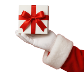 Santa Claus hand in white glove holding a white gift box with red ribbon and bow on black background isolated on a transparent background