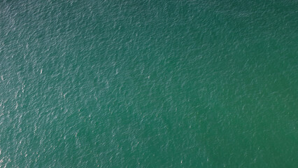 Aerial view drone top shot of over tropical sea. Royalty high-quality free best stock of beautiful wave calm, blue water surface background, top view texture. Turquoise sea backgrounds, paradise relax