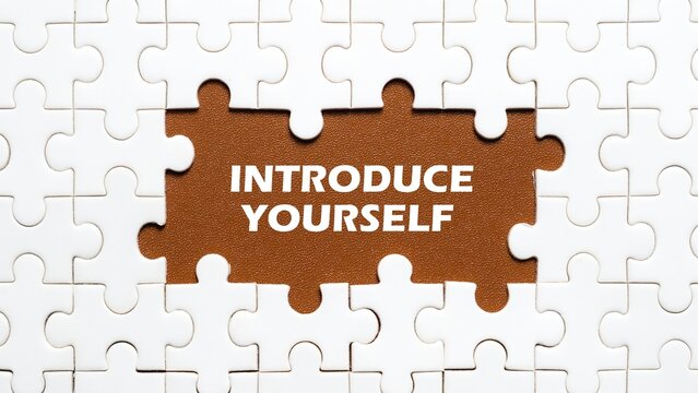 The concept of the writing INTRODUCE YOURSELF in the middle of the puzzle with a brown background.