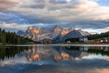 Fantastic Colorful Sunset over the Misurina lake. majestic rock mount on background with reflections. Amazing nature landscape. Wonderful Picturesque scenery of Dolomites Alps.