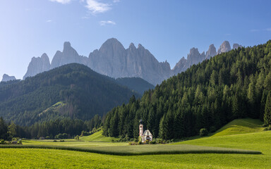 Church with the Dolomites mountains in the background