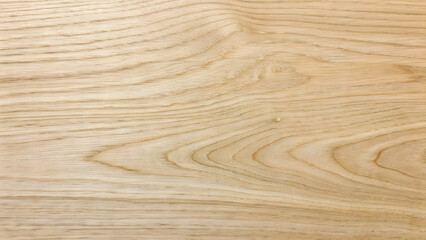 Close-up horizontal shot of light-colored wood grain texture with subtle pinkish vertical stripes