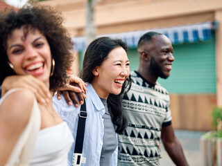 Obraz premium Portrait of group of young people hangout in the city street, walking together and having fun.