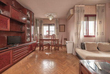 Integrated living and dining area with modular sofa, marble coffee table, and dining area with upholstered bench