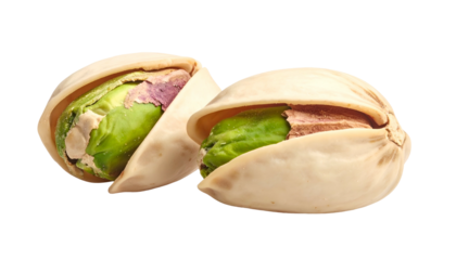 Close-up of two cracked pistachios, revealing vibrant green kernels