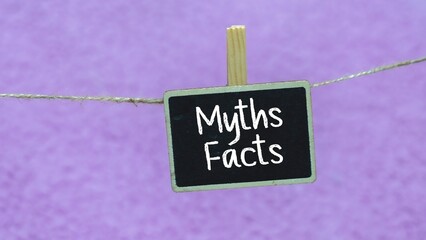 concept of writing MYTHS FACTS on a mini whiteboard.