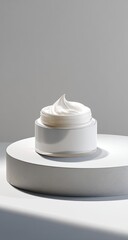 Creamy swirl in a jar on white platform, lit softly
