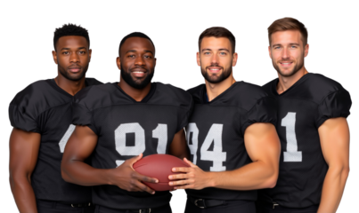Group of diverse, smiling American football players in black jerseys, holding a football