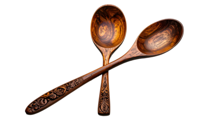 Two crossed wooden spoons, detail showing engraved handles and grain