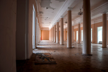 A beautiful hall with columns in a huge abandoned palace. The interiors of an abandoned...