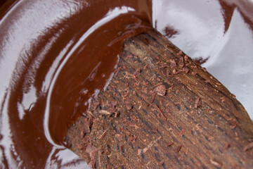 Melted chocolate with a wooden spoon