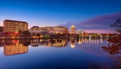 Fototapeta premium stunning arlington va skyline at dusk with vibrant city lights and reflection on the potomac river