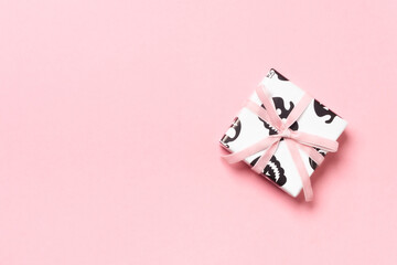 Halloween gift box with cat print and pink ribbon.