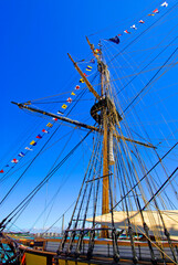 The masts of a tall ship sailing vessel show many angles with ropes and lines In Port Huron Michigan. 10.01.25