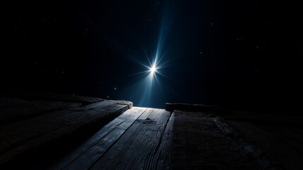 Bright star shining in the night sky above wooden stable, symbolizing the Nativity and Christmas story. Perfect minimalist religious background for holiday cards, posters, or editorial use.