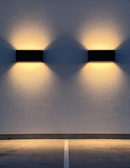 Underground parking wall with dual rectangular sconces casting warm ambient light 
