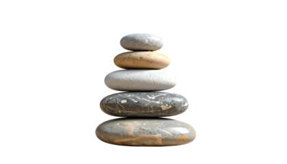 Stacked, balanced stones, against black backdrop, signifying peace